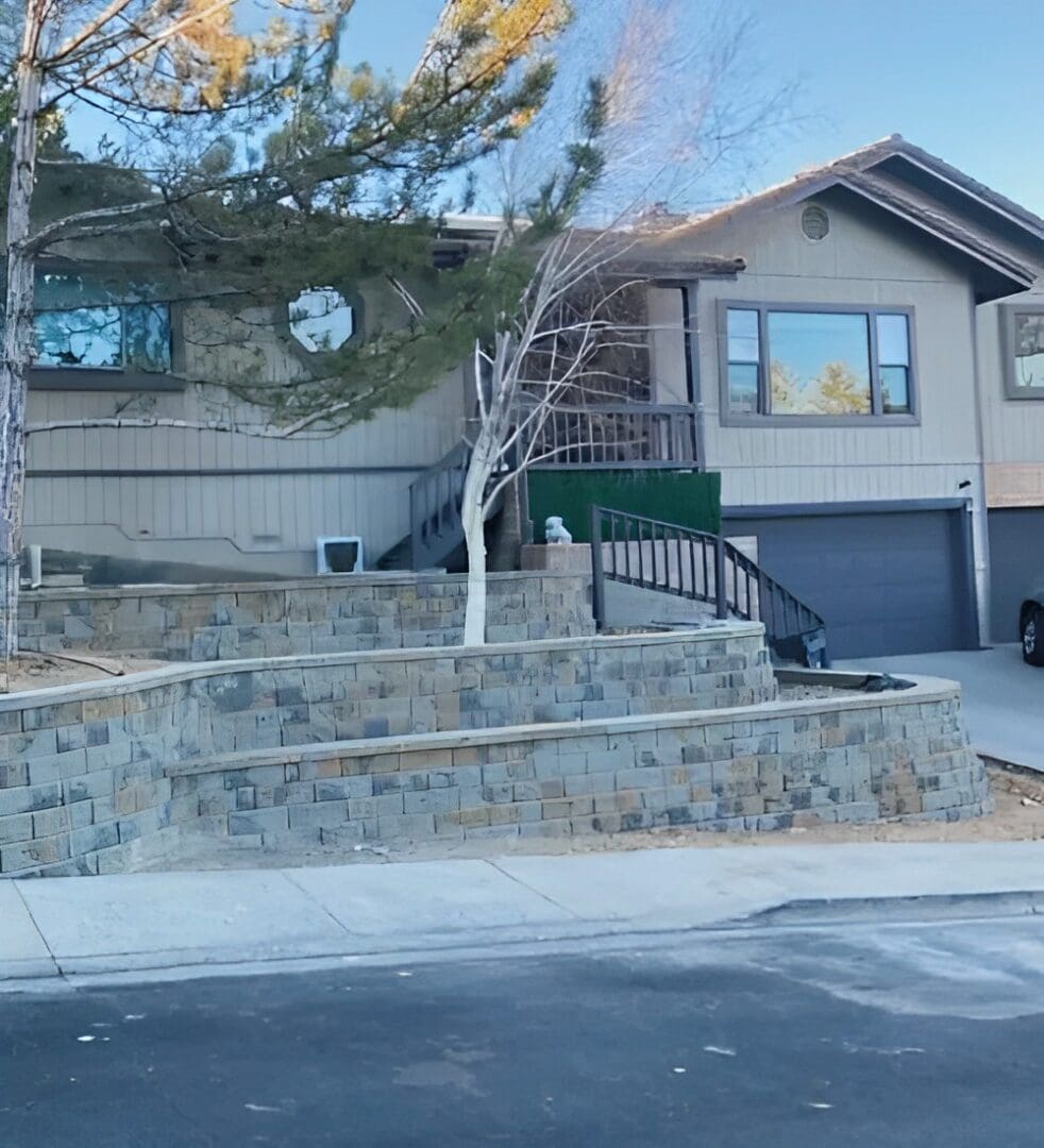 A house with steps and stairs leading to the front of it.